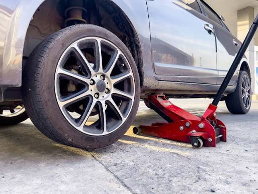 Technician installing a new tire